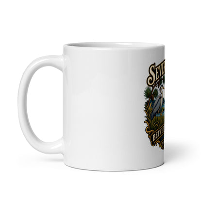 Handle on left: Severna Park Between Two Rivers sailboat and heron artwork with Severn and Magothy lettering on coffee mug