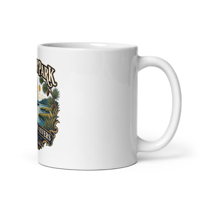 Handle on right: Severna Park Between Two Rivers sailboat and heron artwork with Severn and Magothy lettering on coffee mug